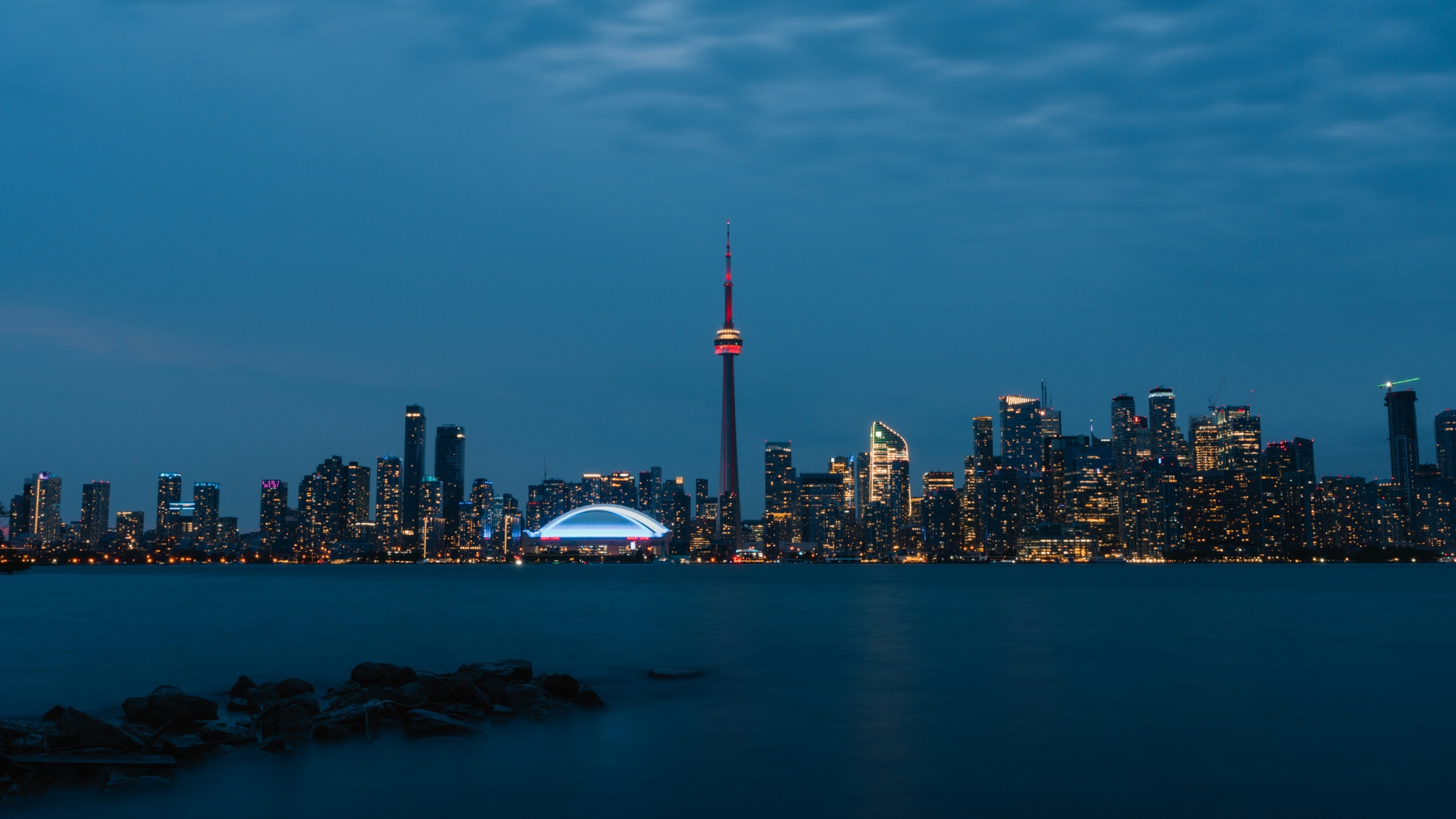 The Toronto skyline and CN Tower at blue hour, seen across the water