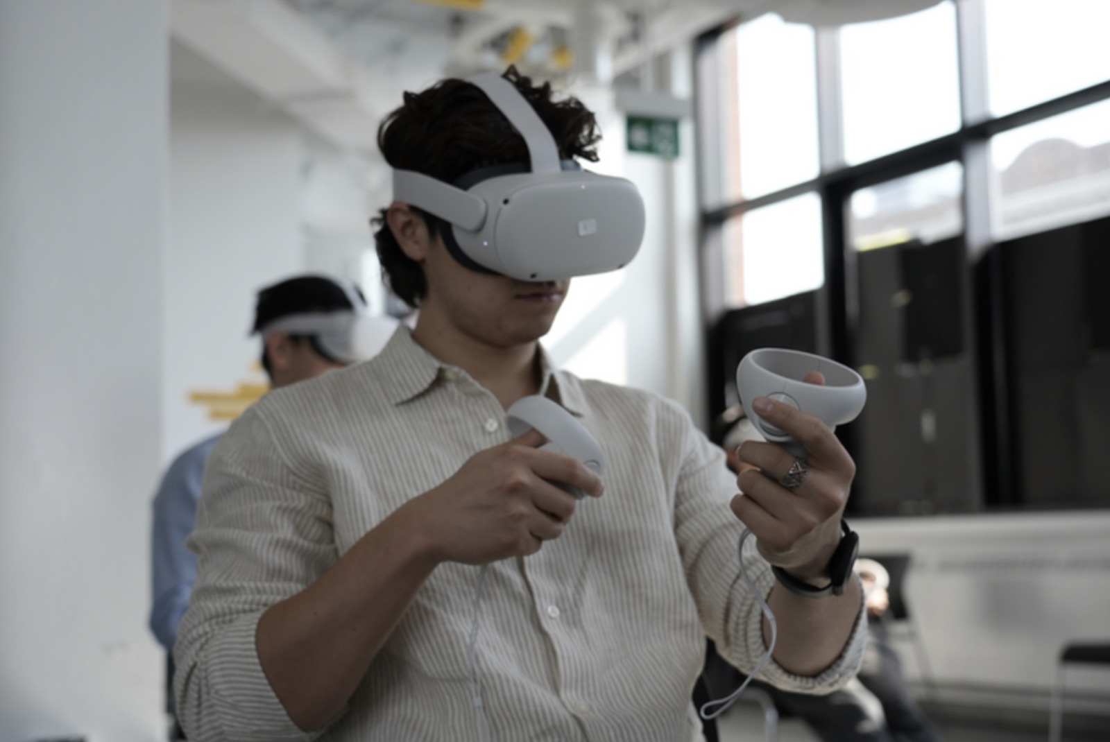 A student trying a Meta Quest VR headset